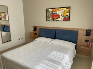 A bed or beds in a room at Appartamento Le Zagare