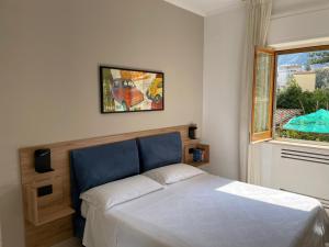 A bed or beds in a room at Appartamento Le Zagare