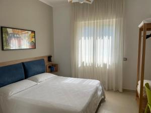 A bed or beds in a room at Appartamento Le Zagare