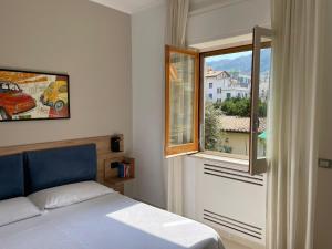 A bed or beds in a room at Appartamento Le Zagare