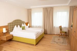 מיטה או מיטות בחדר ב-Landhaus Wilhelmer