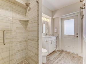 a bathroom with a shower and a toilet and a sink at The View in Saint Augustine +73 photos