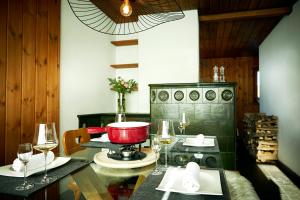 a kitchen with a mixer on a counter with wine glasses at Chalet Horn in Davos Wolfgang