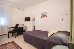 Postel nebo postele na pokoji v ubytování Hotel Buonconsiglio