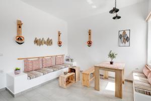 a living room with a couch and a table at Endless Blue from Syros - Vari Resort in Vári
