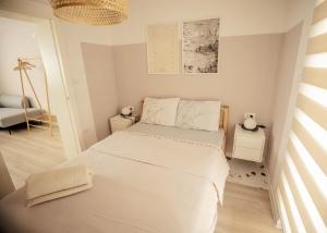 a small bedroom with a bed and a chair at Dusa Zlatibora in Zlatibor