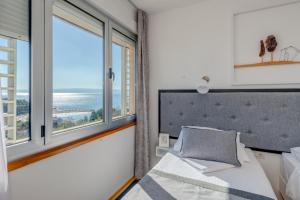 Ένα ή περισσότερα κρεβάτια σε δωμάτιο στο Hotel Pax