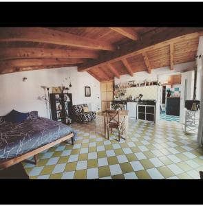 a bedroom with a bed and a table in a room at Casetta Gialla in Giaveno