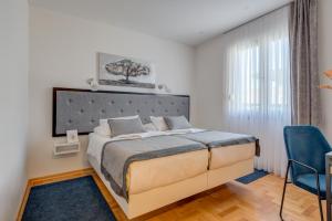 Ένα ή περισσότερα κρεβάτια σε δωμάτιο στο Hotel Pax