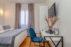 Ένα ή περισσότερα κρεβάτια σε δωμάτιο στο Hotel Pax