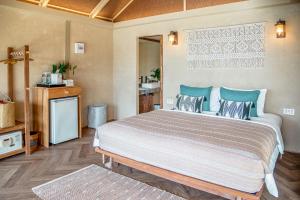 Postel nebo postele na pokoji v ubytování Tolani Resort Koh Kood