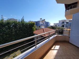 a balcony with a view of a building at Mihasi Apartments in Ksamil