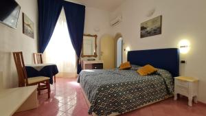 Postel nebo postele na pokoji v ubytování Residenza Sole Amalfi