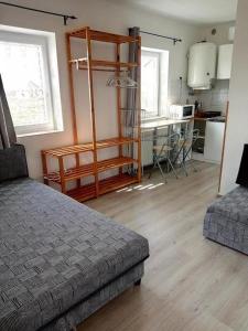 A kitchen or kitchenette at Kiad-lak apartmanok - SZÉP kártya elfogadó Még 16 kép