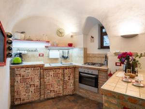 A kitchen or kitchenette at Apartment Mulino Rossi - PTB170 by Interhome