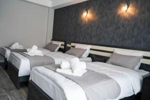 Ένα ή περισσότερα κρεβάτια σε δωμάτιο στο Besami Hotel