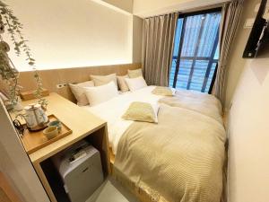 Postel nebo postele na pokoji v ubytování R Hotel Namba + 18 fotografií