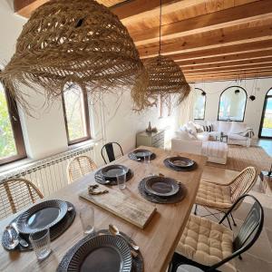 a dining room with a table and chairs at Island House Osljak in Preko