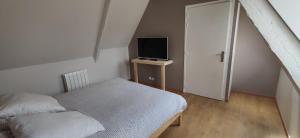 Postel nebo postele na pokoji v ubytování Au calme au coeur de Bayeux