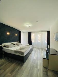 Ένα ή περισσότερα κρεβάτια σε δωμάτιο στο Besami Hotel