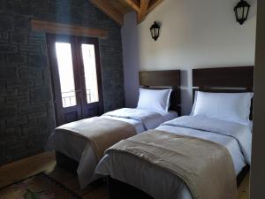 Postel nebo postele na pokoji v ubytování Chri Chri Guesthouse