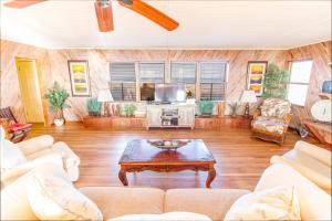 a living room with a couch and a coffee table at Hunter's Haven, 2 Bedrooms, Sleeps 6, Ocean Front, Pet Friendly in Crescent Beach