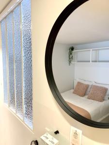Una cama o camas en una habitación de Theodore Oostende-zorgeloos genieten in stijl op de perfecte locatie