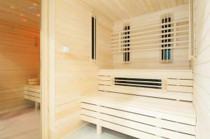 a sauna with wood paneling and a window at Radisson Blu Hotel Wroclaw in Wrocław