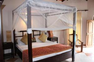 Katil atau katil-katil dalam bilik di Hotel Bentota Village