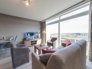 TV a/nebo společenská místnost v ubytování Apartment Astrid 64-902 by Interhome