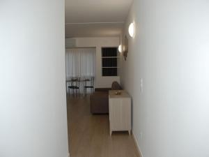 a living room with a couch and a table at Apartment Charming Gardenview App- 105 by Interhome in Bissone