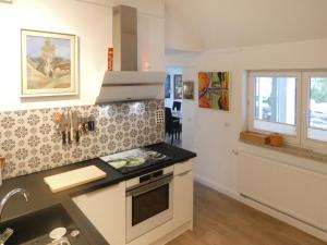a kitchen with a sink and a stove top oven at Holiday Home Grenzenlos by Interhome in Bad Brambach