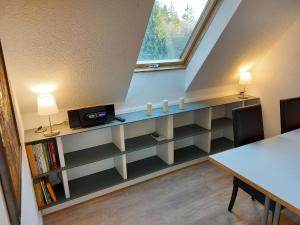 a dining room with a table and a window at Holiday Home Grenzenlos by Interhome in Bad Brambach +20 photos