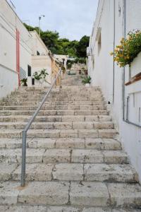 an alley with stone stairs in a town at Apartment La Chicca by Interhome in Santa Cesarea Terme