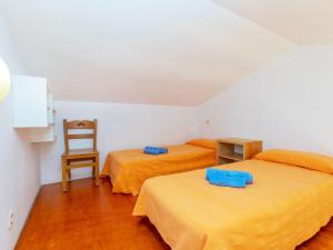 A bed or beds in a room at Apartment Edificio Tamarius by Interhome