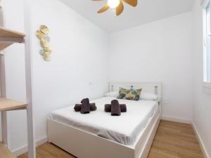 Postel nebo postele na pokoji v ubytování Apartment Constitución Square by Interhome