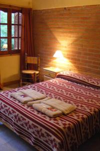 Cama ou camas em um quarto em Hotel Las Termas
