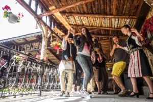 a group of people standing in a building at Pension Mama Cozonacilor in Bran