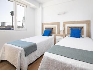 Posteľ alebo postele v izbe v ubytovaní Apartment Hawai by Interhome