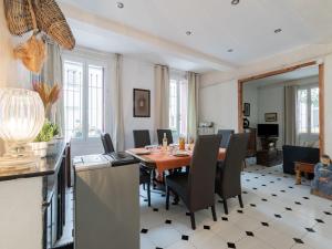 a dining room with a table and chairs at Holiday Home La Maison Theaulon by Interhome in Aigues-Mortes