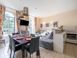 a kitchen and living room with a table and a couch at Apartment Villa Francia-2 by Interhome in Cannes +26 photos