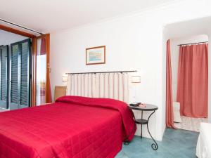 A bed or beds in a room at Apartment Girasole by Interhome