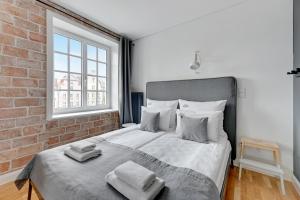 Posteľ alebo postele v izbe v ubytovaní Szeroka Boutique by Downtown Apartments