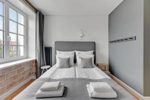 Posteľ alebo postele v izbe v ubytovaní Szeroka Boutique by Downtown Apartments