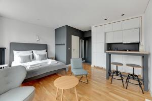 Posteľ alebo postele v izbe v ubytovaní Szeroka Boutique by Downtown Apartments