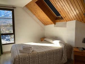 A bed or beds in a room at Hotel Mariana