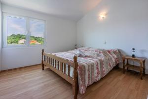Postel nebo postele na pokoji v ubytování Apartments Lino