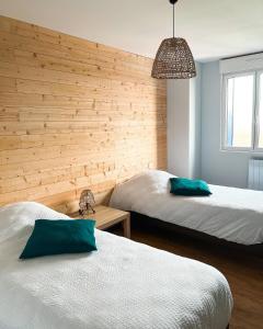 Tempat tidur dalam kamar di Domaine de la Mer