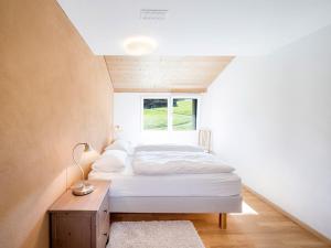 a bedroom with two beds and a window at Ferienwohnung Jones in Pany