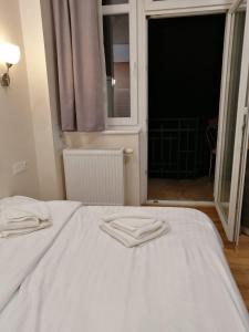 Posteľ alebo postele v izbe v ubytovaní R&B APARTMENTS POZNAŃ